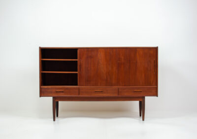 Danish sideboard in teak, 1960s. It contains 3 sliding doors, 3 drawers, lots of starage space and 2 drawers inside. In good condition with some traces of age.