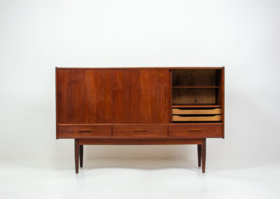 Danish sideboard in teak, 1960s. It contains 3 sliding doors, 3 drawers, lots of starage space and 2 drawers inside. In good condition with some traces of age.