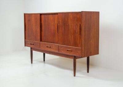 Danish sideboard in teak, 1960s. It contains 3 sliding doors, 3 drawers, lots of starage space and 2 drawers inside. In good condition with some traces of age.