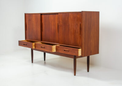 Danish sideboard in teak, 1960s. It contains 3 sliding doors, 3 drawers, lots of starage space and 2 drawers inside. In good condition with some traces of age.