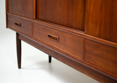 Danish sideboard in teak, 1960s. It contains 3 sliding doors, 3 drawers, lots of starage space and 2 drawers inside. In good condition with some traces of age.
