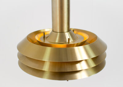 Brass colored Model 705 pendant light by Lyskaer (Denmark, 1970s).This space age beauty contains 4 aluminium shades with a brass colored exterior.Newly rewired and in very good condition.