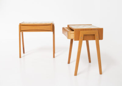 Pair of oak nightstands with mosaic tiles (Denmark, 1970s). They have a very minimalistic design and one shelve with beautiful inset handles. The top is covered with mosaic tiles which gives them a funky look. In very good condition.