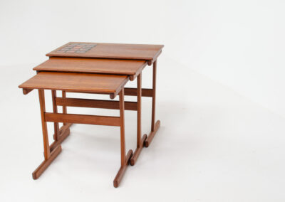 Set of nesting tables with enameled tiles