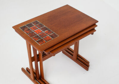 Set of nesting tables with enameled tiles
