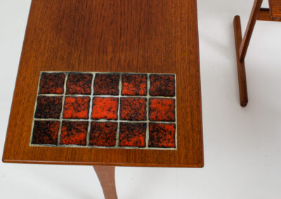 Set of nesting tables with enameled tiles