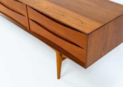 Exceptional Paola sideboard by Oswald Vermaercke for V-Form (Belgium, 1959). An amazing design with a lot of details and a highly sought after extra low height. Featuring two folding doors and four drawers with nice bent wood insides. This unusual low case piece can be perfectly used to put a tv on. In very good condition with some color differences on the top due to UV exposure.