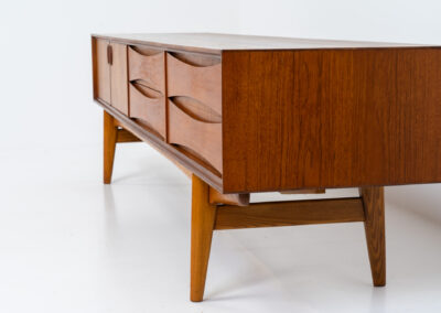 Exceptional Paola sideboard by Oswald Vermaercke for V-Form (Belgium, 1959). An amazing design with a lot of details and a highly sought after extra low height. Featuring two folding doors and four drawers with nice bent wood insides. This unusual low case piece can be perfectly used to put a tv on. In very good condition with some color differences on the top due to UV exposure.