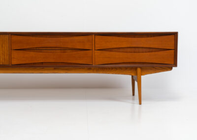 Exceptional Paola sideboard by Oswald Vermaercke for V-Form (Belgium, 1959). An amazing design with a lot of details and a highly sought after extra low height. Featuring two folding doors and four drawers with nice bent wood insides. This unusual low case piece can be perfectly used to put a tv on. In very good condition with some color differences on the top due to UV exposure.