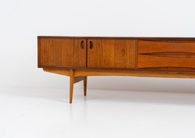 Exceptional Paola sideboard by Oswald Vermaercke for V-Form (Belgium, 1959). An amazing design with a lot of details and a highly sought after extra low height. Featuring two folding doors and four drawers with nice bent wood insides. This unusual low case piece can be perfectly used to put a tv on. In very good condition with some color differences on the top due to UV exposure.