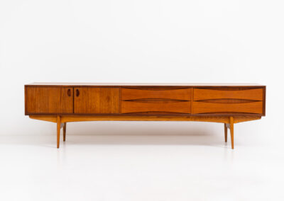 Exceptional Paola sideboard by Oswald Vermaercke for V-Form (Belgium, 1959). An amazing design with a lot of details and a highly sought after extra low height. Featuring two folding doors and four drawers with nice bent wood insides. This unusual low case piece can be perfectly used to put a tv on. In very good condition with some color differences on the top due to UV exposure.