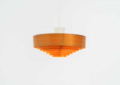 Pine pendant light by Hans-Agne Jakobsson for Ellysett (Sweden, 1960s).The body is made out of pine slats nailed togheter. It can be mounted directly to the ceiling or used as a hanging lamp like it is now. In good condition and newly rewired.