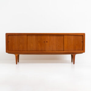 Stunning Danish sideboard in teak, 1960s. This piece is absolutely gorgeous! We are not sure who designed it, but it is referred to “K.L. Dansk” online. It’s extremely detailed and built to very high quality standards. It features four sliding doors with adjustable shelves and three drawers inside. The rounded edges and organic shapes on this piece are just amazing. In perfect condition!