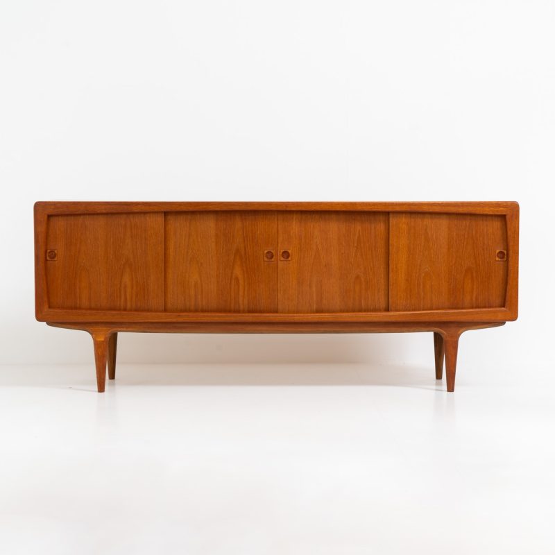 Stunning Danish sideboard in teak, 1960s. This piece is absolutely gorgeous! We are not sure who designed it, but it is referred to “K.L. Dansk” online. It’s extremely detailed and built to very high quality standards. It features four sliding doors with adjustable shelves and three drawers inside. The rounded edges and organic shapes on this piece are just amazing. In perfect condition!