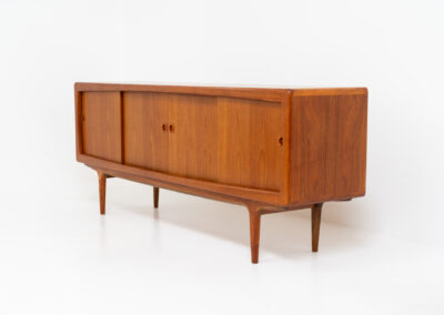 Stunning Danish sideboard in teak, 1960s. This piece is absolutely gorgeous! We are not sure who designed it, but it is referred to “K.L. Dansk” online. It’s extremely detailed and built to very high quality standards. It features four sliding doors with adjustable shelves and three drawers inside. The rounded edges and organic shapes on this piece are just amazing. In perfect condition!