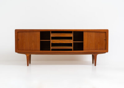 Stunning Danish sideboard in teak, 1960s. This piece is absolutely gorgeous! We are not sure who designed it, but it is referred to “K.L. Dansk” online. It’s extremely detailed and built to very high quality standards. It features four sliding doors with adjustable shelves and three drawers inside. The rounded edges and organic shapes on this piece are just amazing. In perfect condition!