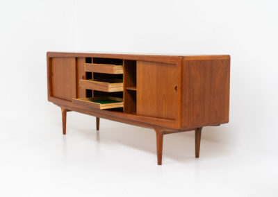 Stunning Danish sideboard in teak, 1960s. This piece is absolutely gorgeous! We are not sure who designed it, but it is referred to “K.L. Dansk” online. It’s extremely detailed and built to very high quality standards. It features four sliding doors with adjustable shelves and three drawers inside. The rounded edges and organic shapes on this piece are just amazing. In perfect condition!