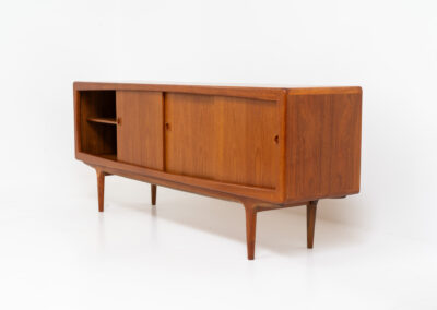 Stunning Danish sideboard in teak, 1960s. This piece is absolutely gorgeous! We are not sure who designed it, but it is referred to “K.L. Dansk” online. It’s extremely detailed and built to very high quality standards. It features four sliding doors with adjustable shelves and three drawers inside. The rounded edges and organic shapes on this piece are just amazing. In perfect condition!