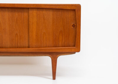 Stunning Danish sideboard in teak, 1960s. This piece is absolutely gorgeous! We are not sure who designed it, but it is referred to “K.L. Dansk” online. It’s extremely detailed and built to very high quality standards. It features four sliding doors with adjustable shelves and three drawers inside. The rounded edges and organic shapes on this piece are just amazing. In perfect condition!