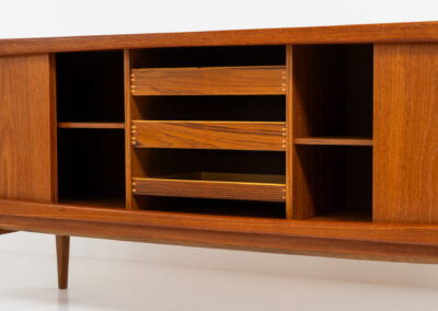 Stunning Danish sideboard in teak, 1960s. This piece is absolutely gorgeous! We are not sure who designed it, but it is referred to “K.L. Dansk” online. It’s extremely detailed and built to very high quality standards. It features four sliding doors with adjustable shelves and three drawers inside. The rounded edges and organic shapes on this piece are just amazing. In perfect condition!