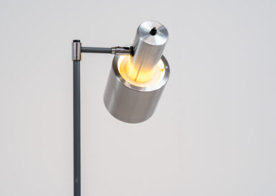 “Studio” floorlamp by Jo Hammerborg for Fog & Mørup (Denmark, 1960s). A design icon in original condition. It’s made out of metal and brushed aluminium. Adjustable in angle. In very good condition with some scratches on the base.
