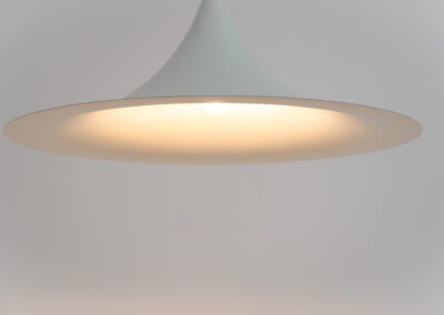 Early ‘model Semi’ pendant light by Claus Bonderup & Thorsten Thorup for Fog & Mørup (Denmark, 1960s).A well known and very timeless design that find its way in any setting. With its 70 cm in diameter, this white lacquered aluminium shade is huge.In very good condition with a few age marks.