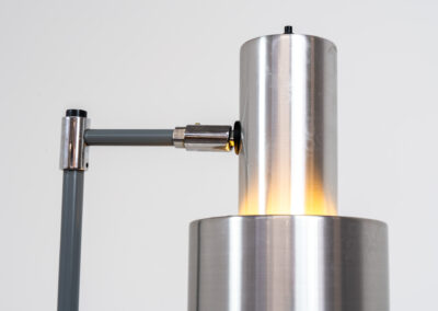 “Studio” floorlamp by Jo Hammerborg for Fog & Mørup (Denmark, 1960s). A design icon in original condition. It’s made out of metal and brushed aluminium. Adjustable in angle. In very good condition with some scratches on the base.