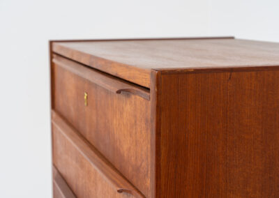 Danish tallboy chest of drawers in teak, 1960s. It contains 8 drawers with beautiful sculpted handles. The teak has a very nice and warm woodgrain. In good condition with normal traces of age and one repair spot.