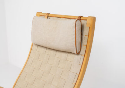 Albert chair by Finn Ostergaard for Kvist Møbler (Denmark, 1960s). A classic example of modern Danish design! It consists of a beech bentwood frame, a woven strap webbing and an adjustable canvas headrest, finished with leather details. In good condition with a nice patina on the straps & canvas.