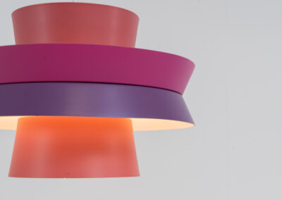 Colourful “Trava” pendant light designed by Carl Thore for Granhaga (Sweden, 1960s). This lamp is surely an eye catcher! It is made out of four aluminium shades laquered in two tints of pink and purple. The lamp is rewired and restored to perfection!