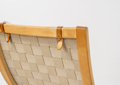 Albert chair by Finn Ostergaard for Kvist Møbler (Denmark, 1960s). A classic example of modern Danish design! It consists of a beech bentwood frame, a woven strap webbing and an adjustable canvas headrest, finished with leather details. In good condition with a nice patina on the straps & canvas.