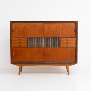 Beautiful and organic Danish highboard, 1960s. A very functional piece with lots of storage space and a wonderful organic shape. It contains four sliding doors, two glass sliding doors and some small drawers. In very good condition with some minor using traces.