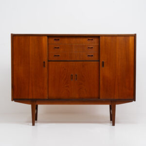 Stunning sideboard in teak by P. Westergaard (Denmark, 1960s). A beautifully crafted piece containing two big sliding doors with lots of storage space, two smaller sliding doors and three drawers. In very good condition!