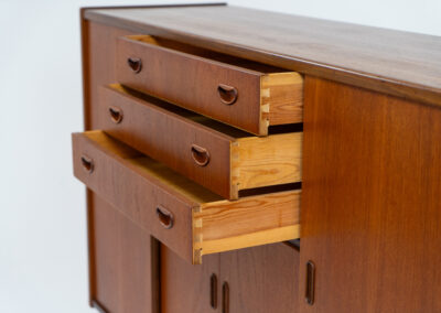 Stunning sideboard in teak by P. Westergaard (Denmark, 1960s). A beautifully crafted piece containing two big sliding doors with lots of storage space, two smaller sliding doors and three drawers. In very good condition!