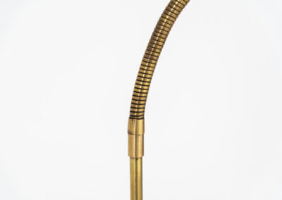 Early model of the “Bellevue AJ7” floor lamp by Arne Jacobsen (Denmark, 1929). This early model of the Bellevue series, made with a solid brass stand, is extremely rare to find. It was designed for “The house of the future” exhibition in Copenhagen in 1929. It is adjustable in height and angle. This piece is fully restored and in amazing condition. The brass has a very nice patina.