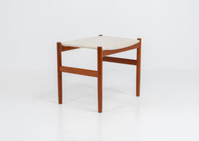 Rare stool by Hugo Frandsen for Spøttrup (Denmark, 1960s). Made with an elegant solid teak frame and newly upholstered in a beige fabric. In perfect condition! Marked by maker.