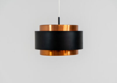 Stunning Saturn pendant light by Jo Hammerborg for Fog & Mørup (Denmark, 1960s). A stunning design with a beatutiful contrast between copper and matte black. At the top and the bottom, the lamp is closed by two acrylic plates that create an anti-dazzle and glare-free effect. A high end piece, made with quality materials. In very good condition! It features the original Fog & Mørup lable inside.