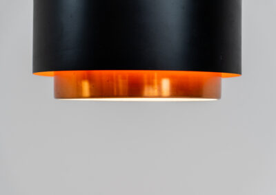 Stunning Saturn pendant light by Jo Hammerborg for Fog & Mørup (Denmark, 1960s). A stunning design with a beatutiful contrast between copper and matte black. At the top and the bottom, the lamp is closed by two acrylic plates that create an anti-dazzle and glare-free effect. A high end piece, made with quality materials. In very good condition! It features the original Fog & Mørup lable inside.