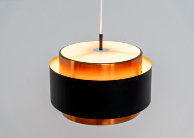 Stunning Saturn pendant light by Jo Hammerborg for Fog & Mørup (Denmark, 1960s). A stunning design with a beatutiful contrast between copper and matte black. At the top and the bottom, the lamp is closed by two acrylic plates that create an anti-dazzle and glare-free effect. A high end piece, made with quality materials. In very good condition! It features the original Fog & Mørup lable inside.