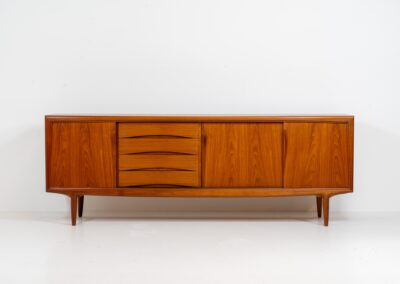 Sideboard by Gunni Omann for Axel Christensen, ACO (Denmark, 1960s). A wonderful teak sideboard with a lot of details and organic finishes. The drawers and handles on this one are just amazing. A high quality Danish piece in very good condition. It has some minor traces of age and use.
