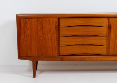 Sideboard by Gunni Omann for Axel Christensen, ACO (Denmark, 1960s). A wonderful teak sideboard with a lot of details and organic finishes. The drawers and handles on this one are just amazing. A high quality Danish piece in very good condition. It has some minor traces of age and use.