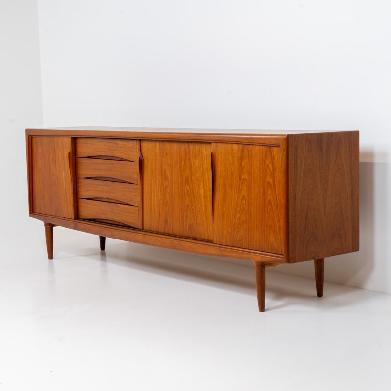 Sideboard by Gunni Omann for Axel Christensen, ACO (Denmark, 1960s). A wonderful teak sideboard with a lot of details and organic finishes. The drawers and handles on this one are just amazing. A high quality Danish piece in very good condition. It has some minor traces of age and use.