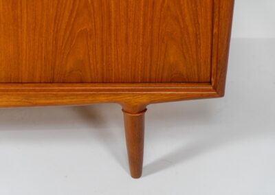 Sideboard by Gunni Omann for Axel Christensen, ACO (Denmark, 1960s). A wonderful teak sideboard with a lot of details and organic finishes. The drawers and handles on this one are just amazing. A high quality Danish piece in very good condition. It has some minor traces of age and use.