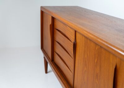 Sideboard by Gunni Omann for Axel Christensen, ACO (Denmark, 1960s). A wonderful teak sideboard with a lot of details and organic finishes. The drawers and handles on this one are just amazing. A high quality Danish piece in very good condition. It has some minor traces of age and use.