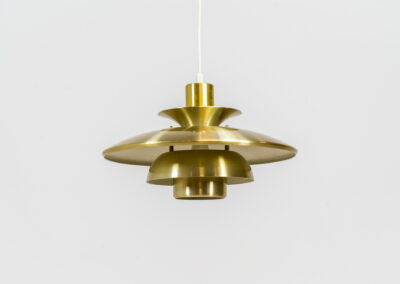 Brass colored pendant light by Lyskaer (Denmark, 1970s). A beautiful lamp made out of four aluminium shades with a brass colored exterior. Newly rewired and in very good condition. Labeled by maker.