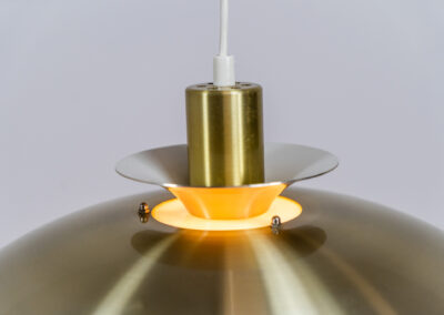 Brass colored pendant light by Lyskaer (Denmark, 1970s). A beautiful lamp made out of four aluminium shades with a brass colored exterior. Newly rewired and in very good condition. Labeled by maker.