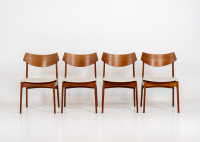 Set of 4 dining chairs by Erik Buch for Funder-Schmidt & Madsen (Denmark, 1950s). Durable Danish quality and a beautiful design, made out of teak. They have nice organic lines and the typical floating seats. The chairs are fully restored and newly upholstered in a beige fabric. Ready for another lifetime.