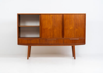 Sideboard by E.W. Bach for Sejling Skabe (Denmark, 1960s). A very elegant piece with ideal dimensions. It contains three sliding doors and three drawers with nice sculptural handles. The inside has lots of storage space with adjustable shelves and 2 small drawers aswel. An amazing Danish quality piece ready for another lifetime! In very good condition with some minor repair marks.