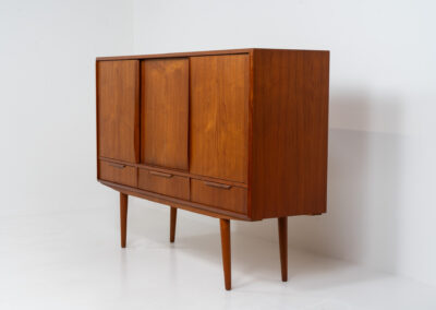 Sideboard by E.W. Bach for Sejling Skabe (Denmark, 1960s). A very elegant piece with ideal dimensions. It contains three sliding doors and three drawers with nice sculptural handles. The inside has lots of storage space with adjustable shelves and 2 small drawers aswel. An amazing Danish quality piece ready for another lifetime! In very good condition with some minor repair marks.