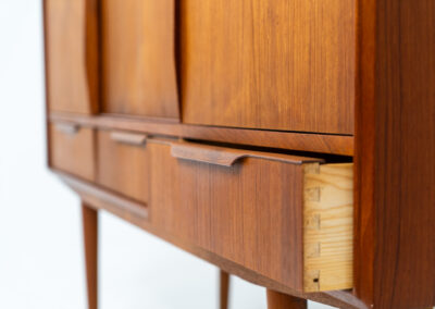 Sideboard by E.W. Bach for Sejling Skabe (Denmark, 1960s). A very elegant piece with ideal dimensions. It contains three sliding doors and three drawers with nice sculptural handles. The inside has lots of storage space with adjustable shelves and 2 small drawers aswel. An amazing Danish quality piece ready for another lifetime! In very good condition with some minor repair marks.